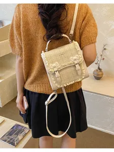 Mini plaid backpack detail view, featuring cute bows and lace trim for daily commuter style.