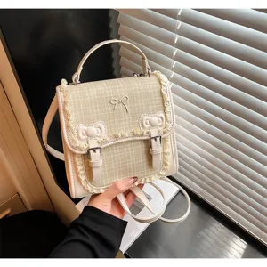 Chic mini tweed backpack for women, cute lace trim and bow design, stylish commuter daypack.