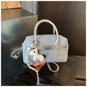 Stylish denim shoulder bag for women, versatile contrast color handbag with chic horse charm.