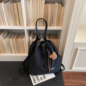 Stylish black nylon bucket backpack for women, casual multi-function shoulder and daily bag.