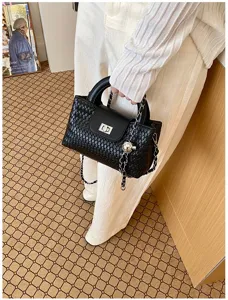 Black woven leather handbag for women, chic top handle messenger bag with metal chain strap.