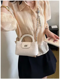 White woven crossbody bag for women with top handle and metal chain strap chic style.