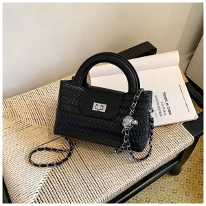 Black woven handbag featuring a chic round handle, secure flap closure, and trendy chain strap.