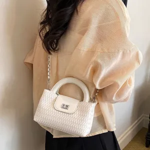 Elegant white woven crossbody bag with top handle and chain strap for women summer fashion.