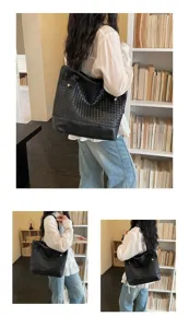 Vue détaillée d'un élégant sac cabas en cuir noir tissé avec un savoir-faire unique.