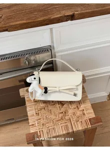 Bolso de mano blanco de cuero con lazo y colgante, elegante bolso cruzado para mujer.