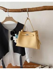 Stylish women's yellow leather shoulder bag vintage top handle tote handbag for daily commute.