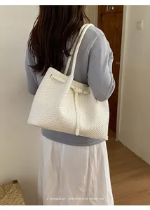 White woven tote bag for women, minimalist retro shoulder bucket bag with strap design.