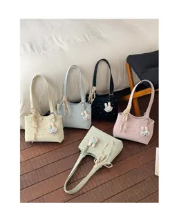 Casual large capacity tote bag with floral print, cute bunny charm, and stylish design.