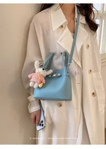 Bolso bombonera de cuero azul claro para mujer elegante bolso de mano cruzado con conejito