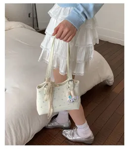 Casual printed shoulder bag for women, stylish underarm bag with cute bunny pendant daily.