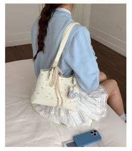 Detailed view of women casual floral print shoulder bag underarm bag with lace ribbon and cute pendant.