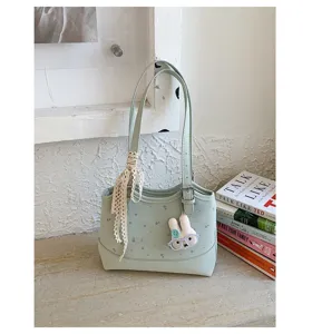 Light green floral shoulder bag detail with cute bunny pendant and lace ribbon, stylish daily use.