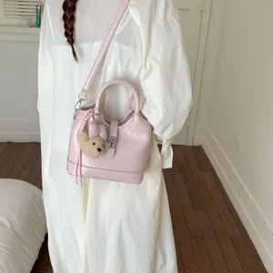 Sac seau rose pour femmes élégant sac à main bandoulière en cuir PU avec pendentif