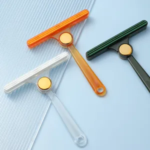 T-shaped pet hair remover brush for carpets and clothes, double-sided lint cleaner tool.