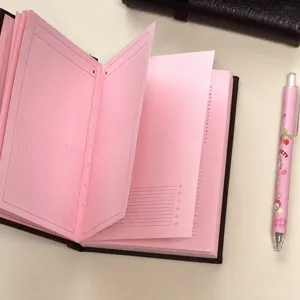Pink inner page notebook detail, A6 aesthetic diary handbook page view, thick paper.