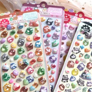 Close-up detail of 3D puffy crystal animal stickers showing cute cartoon designs and glossy texture.