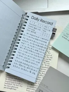 Korean A6 slim spiral notebook, minimalist ins style diary planner with daily record layout.