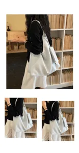 Light blue slouchy shoulder bag detail view, large capacity casual tote bag with small pouch.