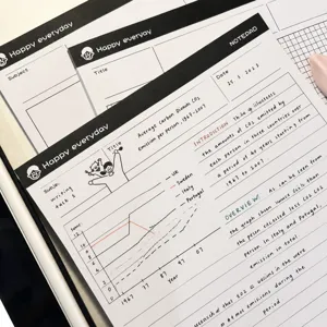 Close-up detail of B5 grid notepad with handwritten English notes, neat study layout and lines.