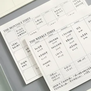 Minimalist monthly and weekly planner notebook for efficient work schedule and study.