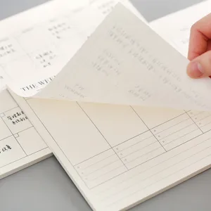 Minimalist weekly planner notepad with tear-away sheets for daily office schedule