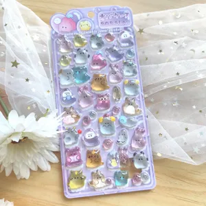 Close-up detail of 3d crystal jewel stickers featuring cute cartoon ghost and animal designs.