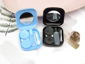 Portable contact lens case set with mirror, double box, tweezers, and solution bottle.