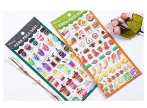 Detailed close-up of cute 3d food and dessert foam stickers for hand ledger phone decor.