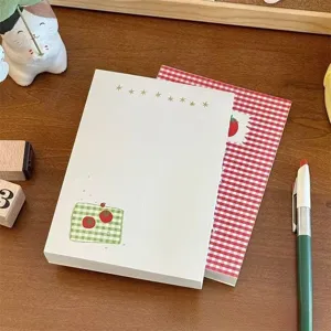Cute mini blank notebook with tomato grid pattern, perfect for daily journaling and notes.