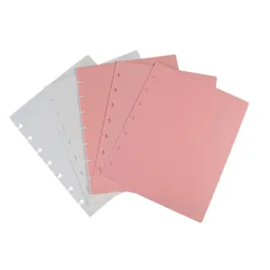 Plastic discbound notebook cover planner binder accessory set in pink and translucent colors.