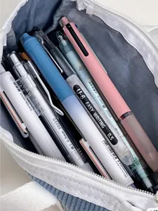 Corduroy pencil pouch detail showing large capacity stationery storage inside bag.