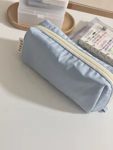 Minimalist milk blue pencil case and sleek stationery storage pouch for daily use.
