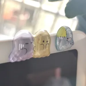 Detailed view of 3D crystal ghost stickers showing cute cartoon designs on a device surface.