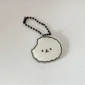 Cute cartoon dog acrylic keychain detail shot pendant, smooth edge, black bead chain accessory.