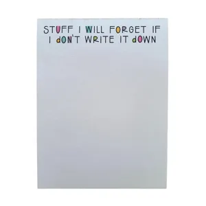 Detail view of funny notepad with funny printed quote, minimalist white stationery design.