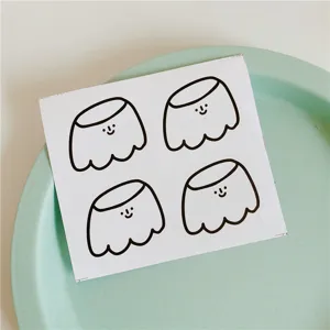 Cute minimalist cartoon pudding sticker set with simple smiling faces, ideal for journaling.