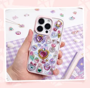 Close-up detail of cute Japanese magical girl gemstone phone case with sparkly resin charms.