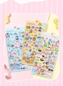 Close-up detail of 3D crystal gel stickers with cute animal and sushi designs for crafts.