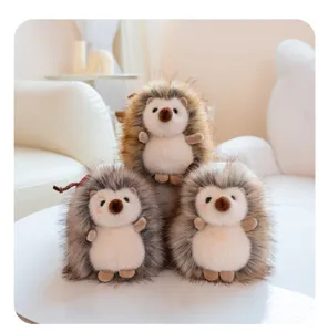 Cute fluffy hedgehog plush toy detail view, soft faux fur pendant for bags or keys.