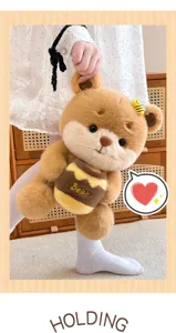 Cute bee bear plush toy holding honey pot, soft stuffed doll birthday gift for kids.