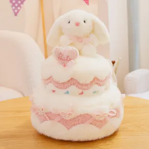 Joli lapin en peluche gâteau à deux étages avec nœuds roses cadeau d'anniversaire.