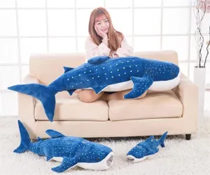 Whale shark plush toy detail view showing soft blue fabric, white spots and shark design.