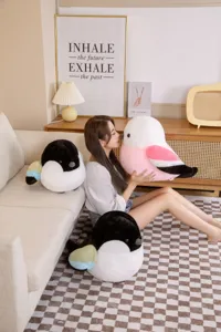 Cozy living room detail view of cute Java sparrow plush toy pillow with extremely soft material.