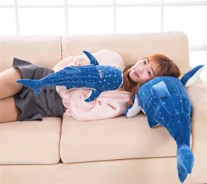 Cute whale shark plush toy lifestyle detail shot, soft stuffed pillow for cozy home decor.