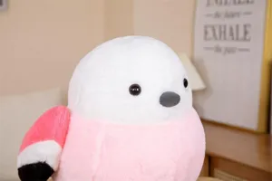 Close-up detail of cute round plush bird toy, soft pink and white stuffed animal doll.