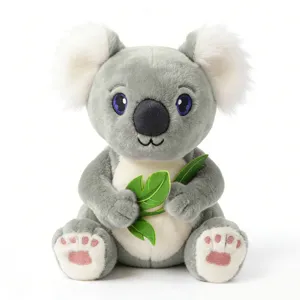Süßes graues Koala Plüschtier mit flauschigen weißen Ohren und grünen Blättern, weiche Puppe.