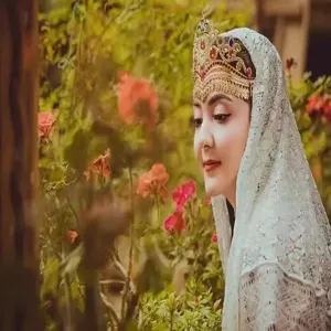 Exquisite lace headscarf detail showing intricate hollow embroidery and elegant vintage style.