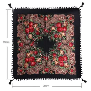 Ethnic style square scarf with vintage floral print and delicate black tassel trim details.