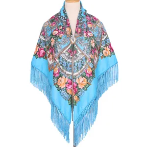 Detailed view of the vibrant blue Russian style floral square shawl with elegant long fringes.